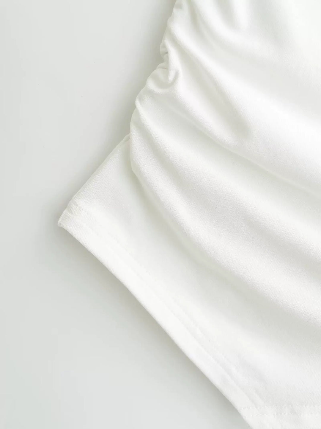 シェルボタンサイドギャザーシャープヘムベアトップ